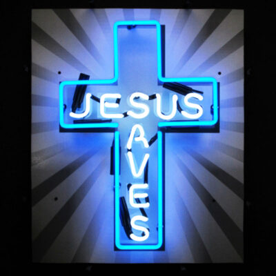 A blue Jesus Saves cross neon sign.