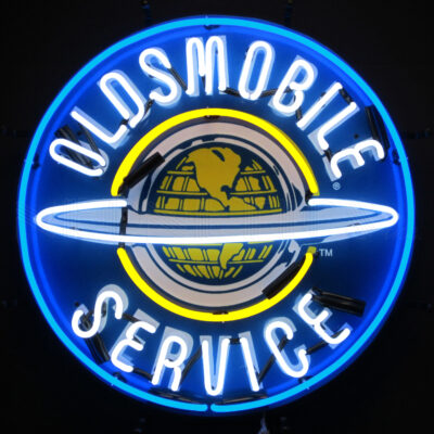 A round blue and white Oldsmobile neon sign.